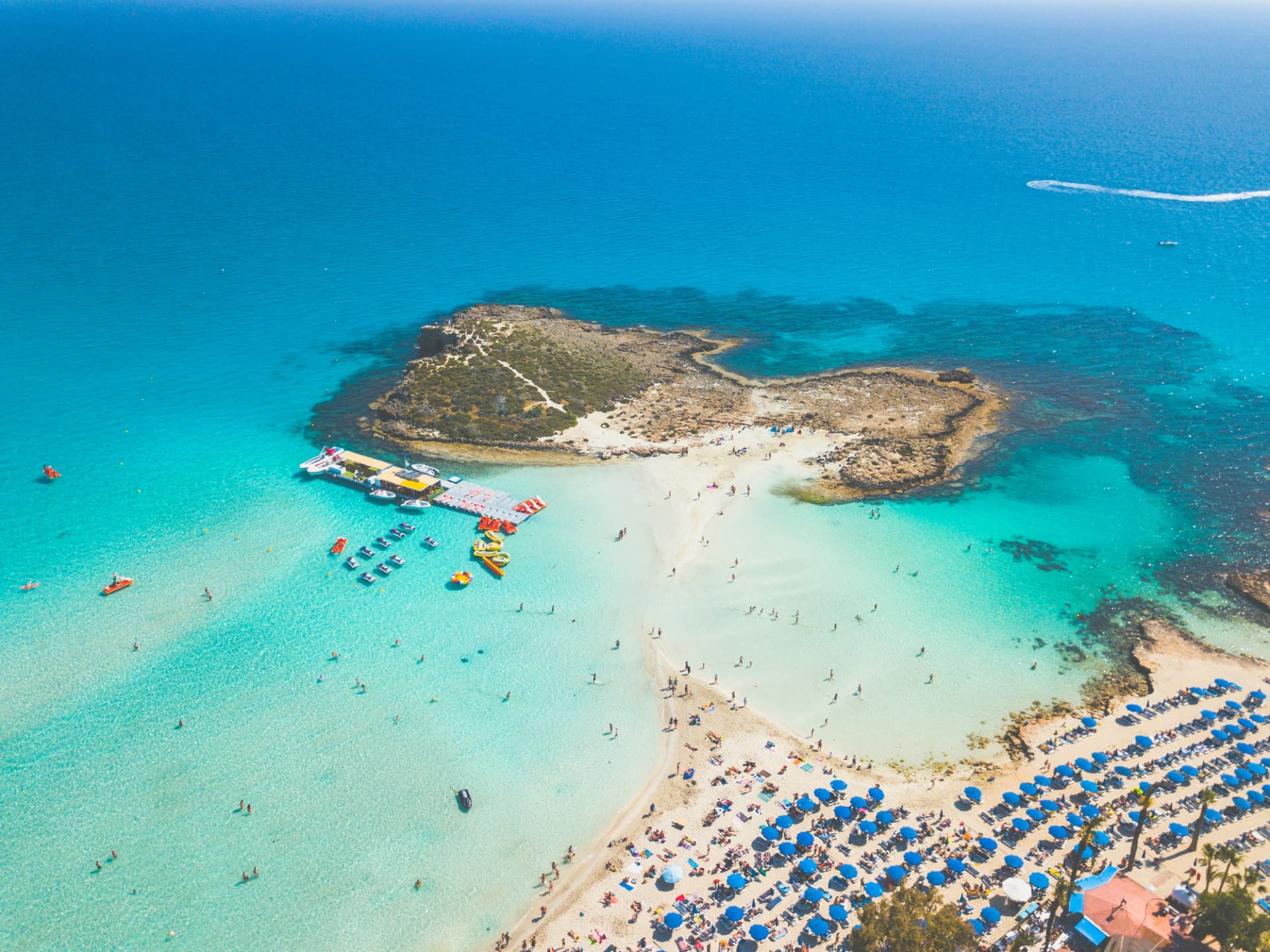 Aerial view of Nissi Beach, Cyprus, with turquoise water and white sand
